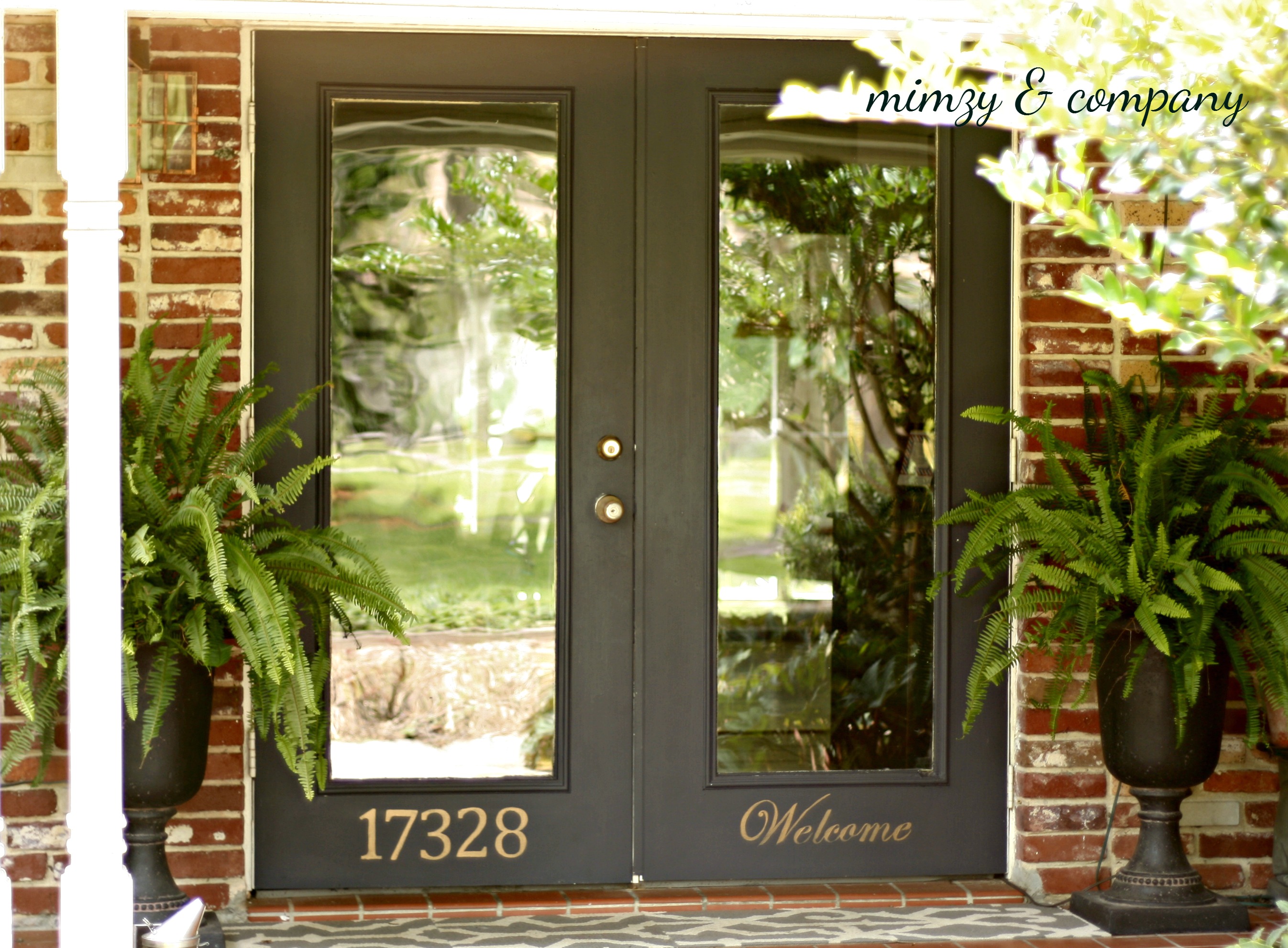 black front doors with gold house number