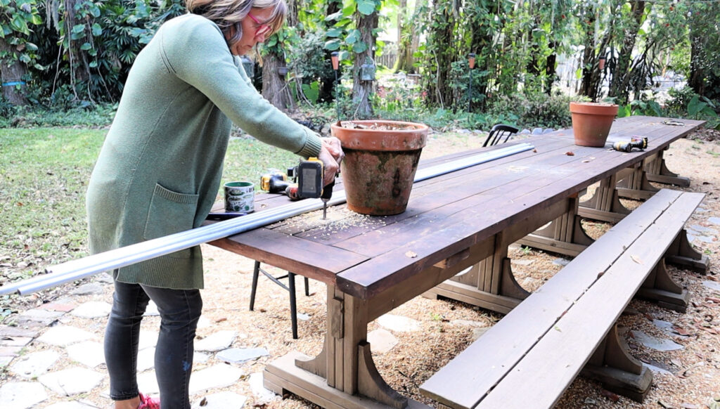 drilling a hole in a tabletop for a tabletop trellis